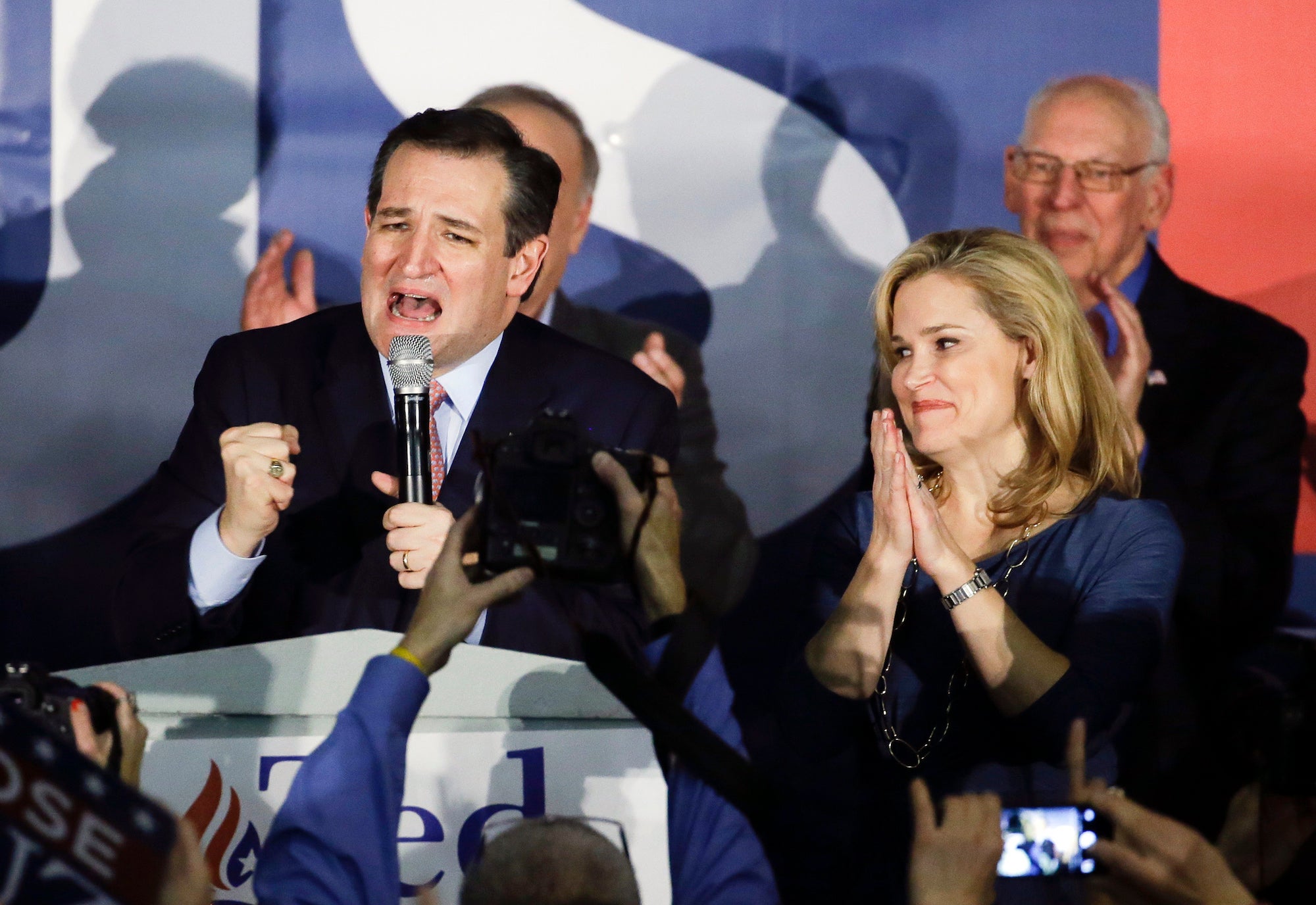 Ted Cruz speaks during a caucus rally with his wife Heidi in Des Moines, Iowa.