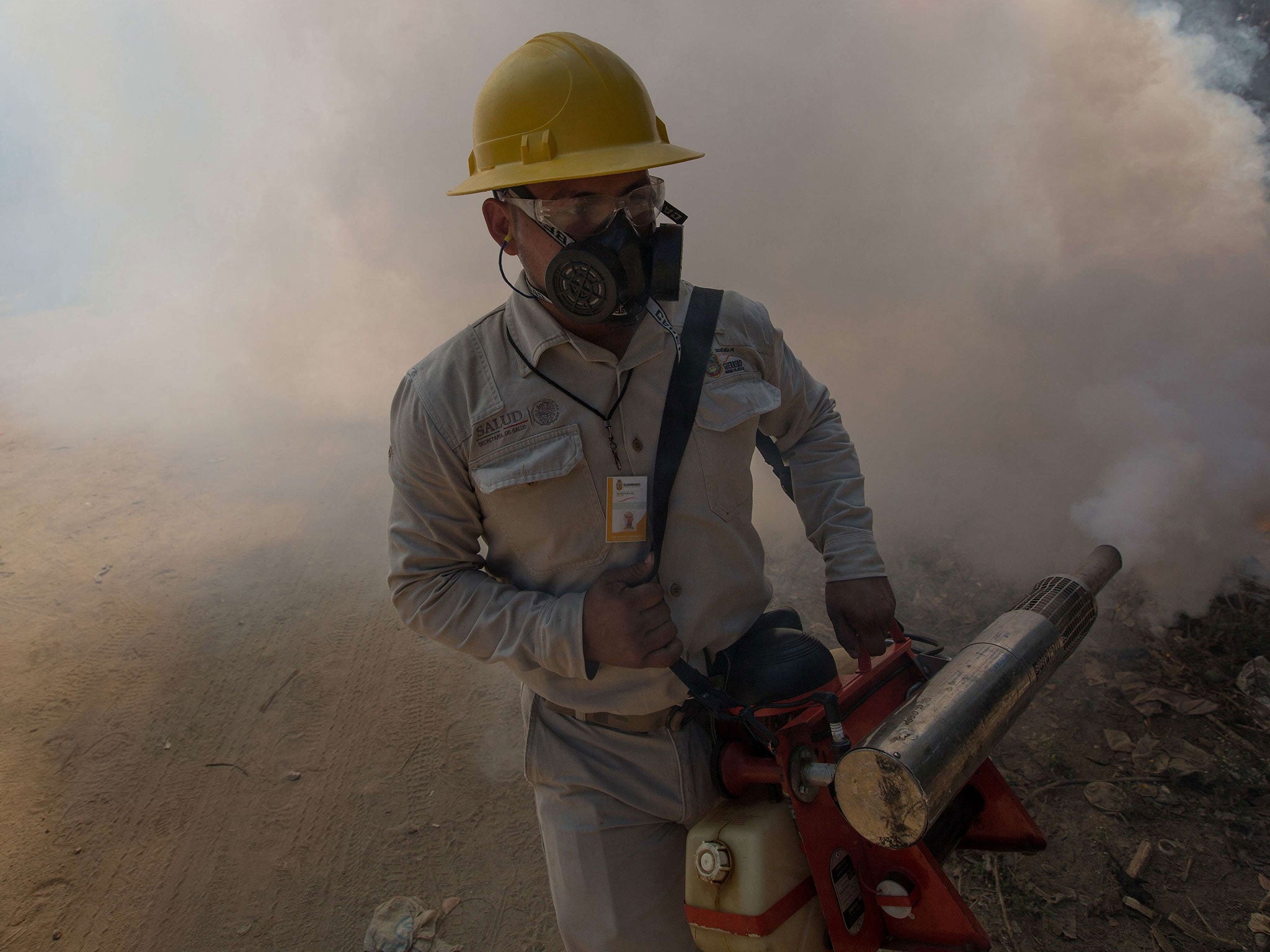 A health worker fumigates in Mexico