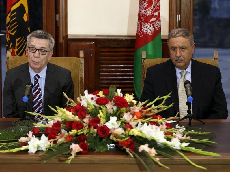German Interior Minister Thomas de Maiziere and his Afghan counterpart Nur ul-Haq Ulumi address a joint news conference in Kabul, Afghanistan