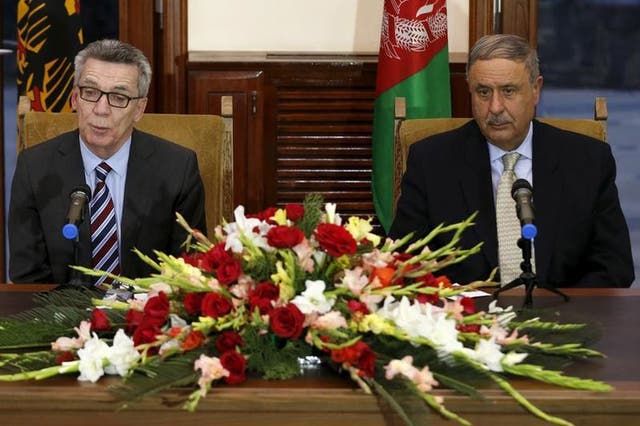 German Interior Minister Thomas de Maiziere and his Afghan counterpart Nur ul-Haq Ulumi address a joint news conference in Kabul, Afghanistan