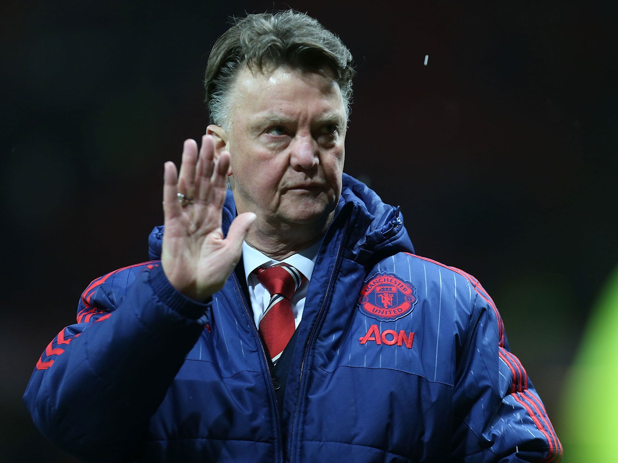 Manchester United manager Louis van Gaal waves to the fans after the 3-0 win over Stoke