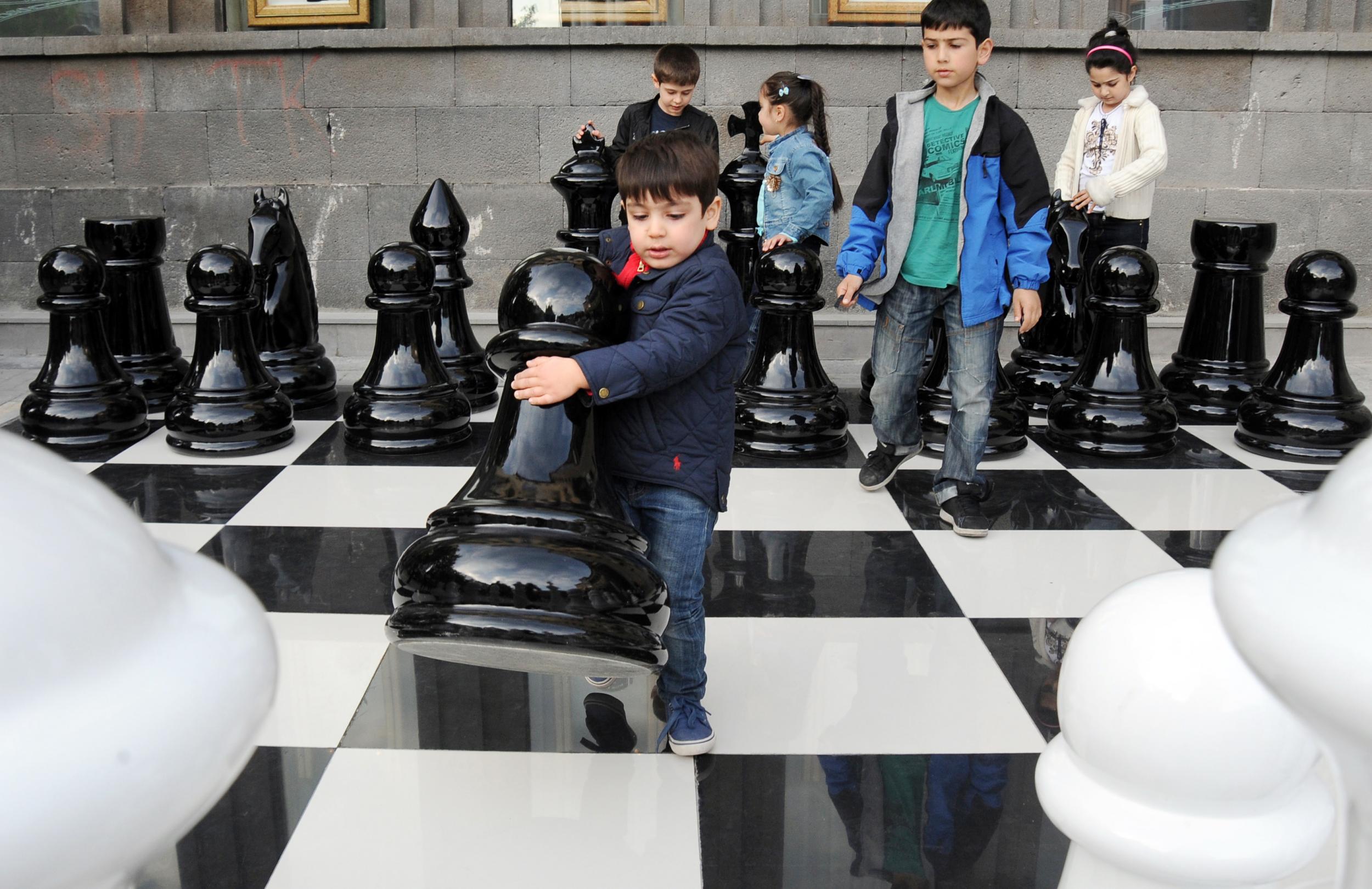 Children play jumbo chess in Yerevan, Armenia