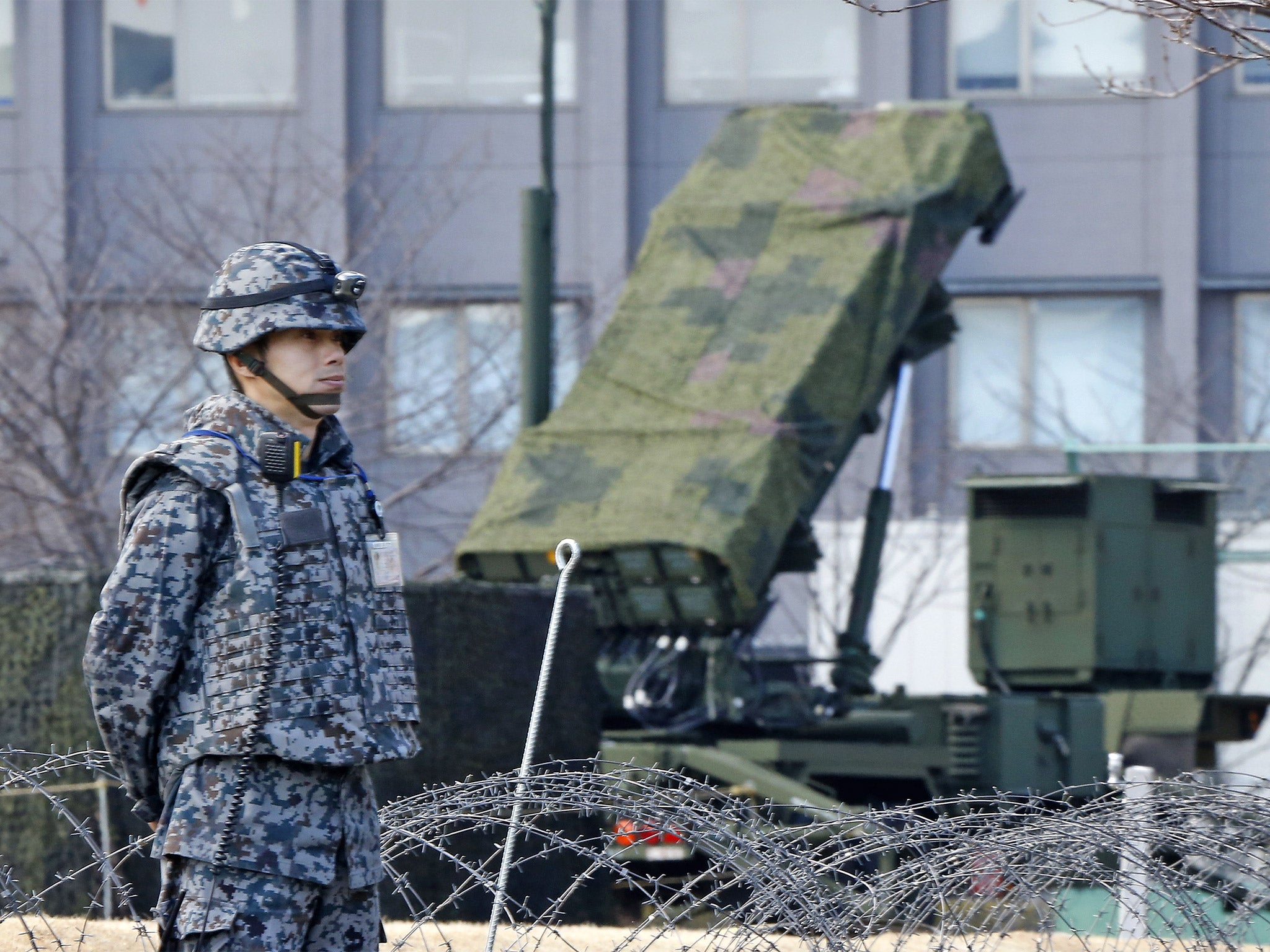 A Japanese soldier stands by a PAC-3 Patriot missile unit deployed for North Korea's rocket launch at the Defence Ministry in Tokyo