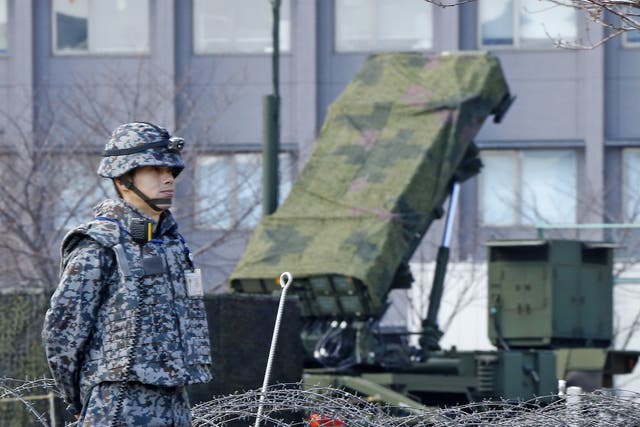 A Japanese soldier stands by a PAC-3 Patriot missile unit deployed for North Korea's rocket launch at the Defence Ministry in Tokyo