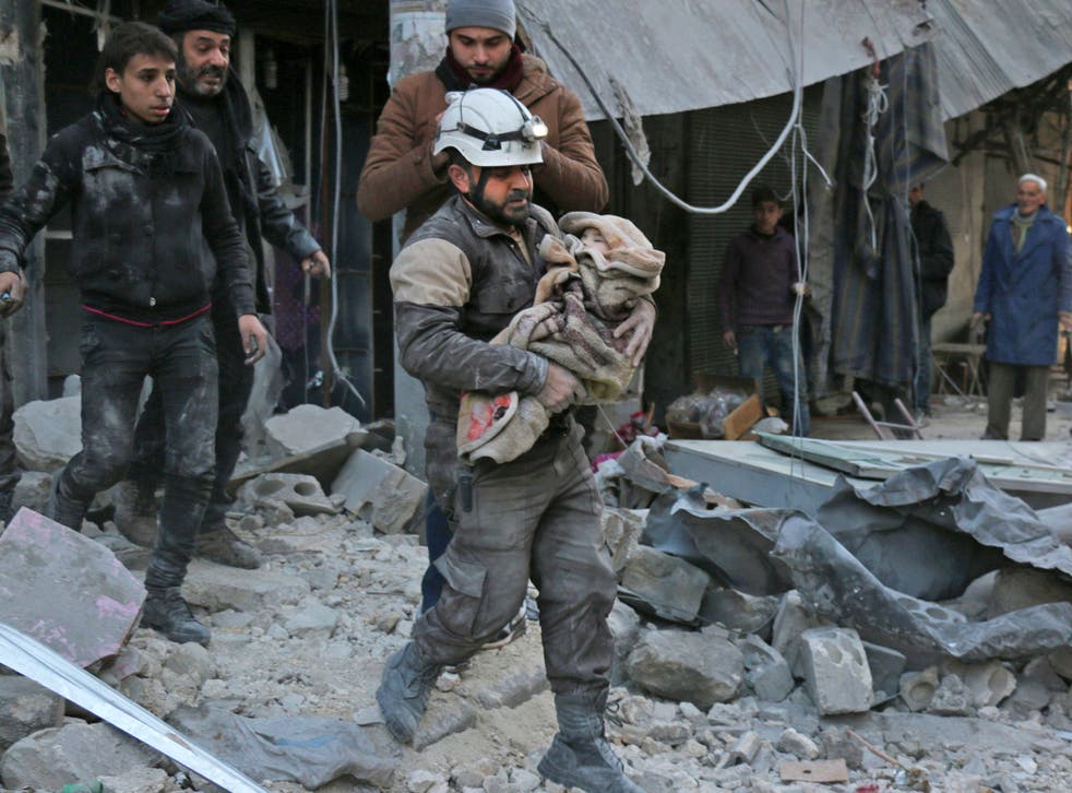 A baby is rescued following Syrian government air strikes in Aleppo last month