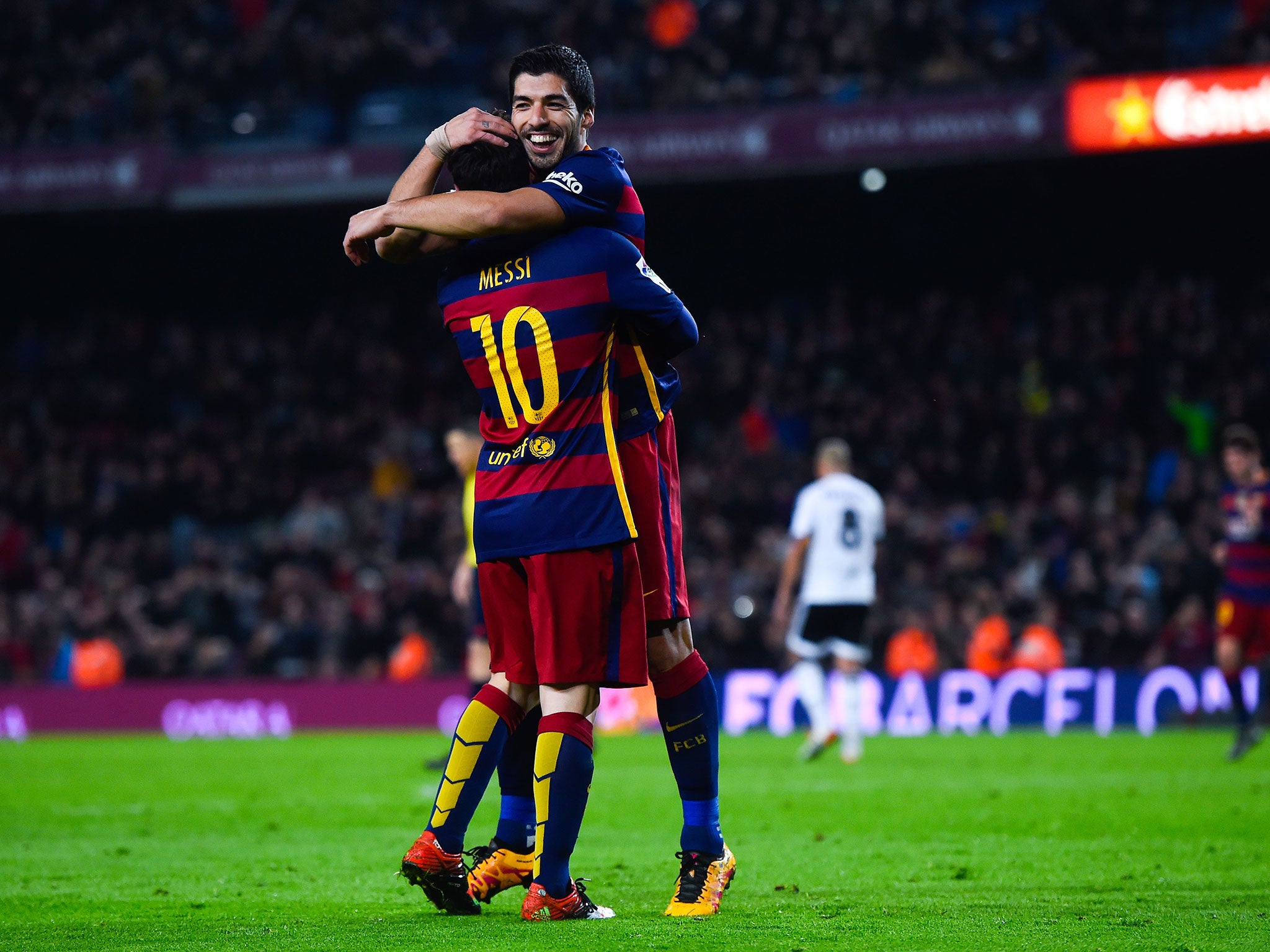 Luis Suarez and Lionel Messi celebrate