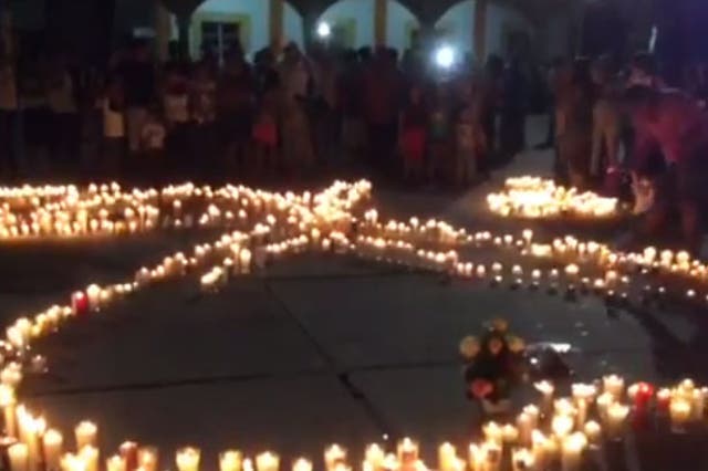 A vigil held in memory of 7-month-old Marcos Miguel Pano Colon and his parents after they were shot to death on Friday