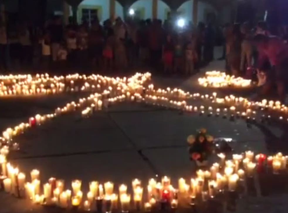 A vigil held in memory of 7-month-old Marcos Miguel Pano Colon and his parents after they were shot to death on Friday