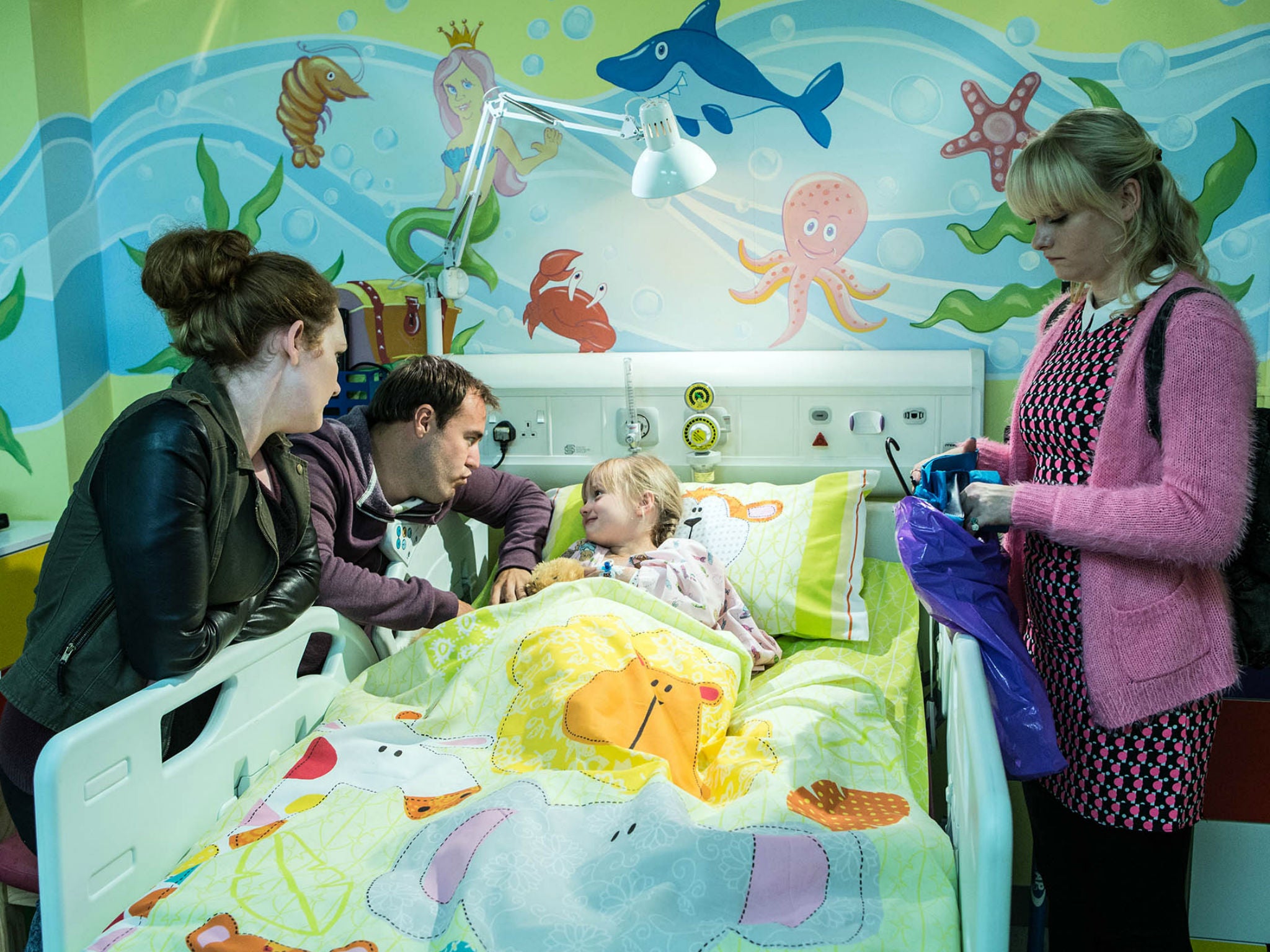 Hope's family gather around her hospital bed in Coronation Street