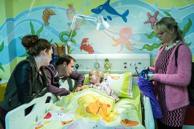 Hope's family gather around her hospital bed in Coronation Street