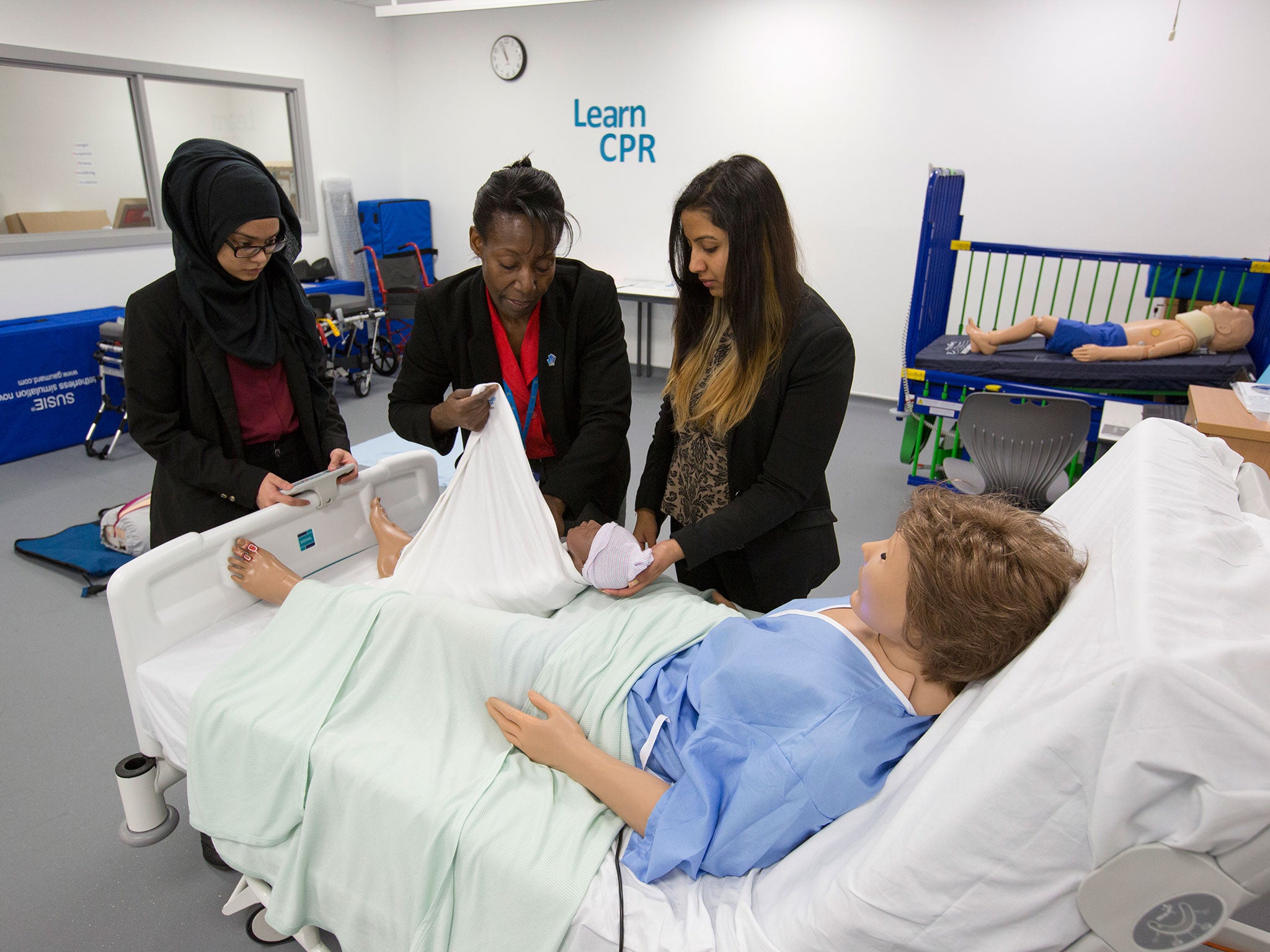 Students learn how to deal with patients on a mock-up of a hospital ward (called a simulation ward) at the Health Futures University Training College in West Bromwich