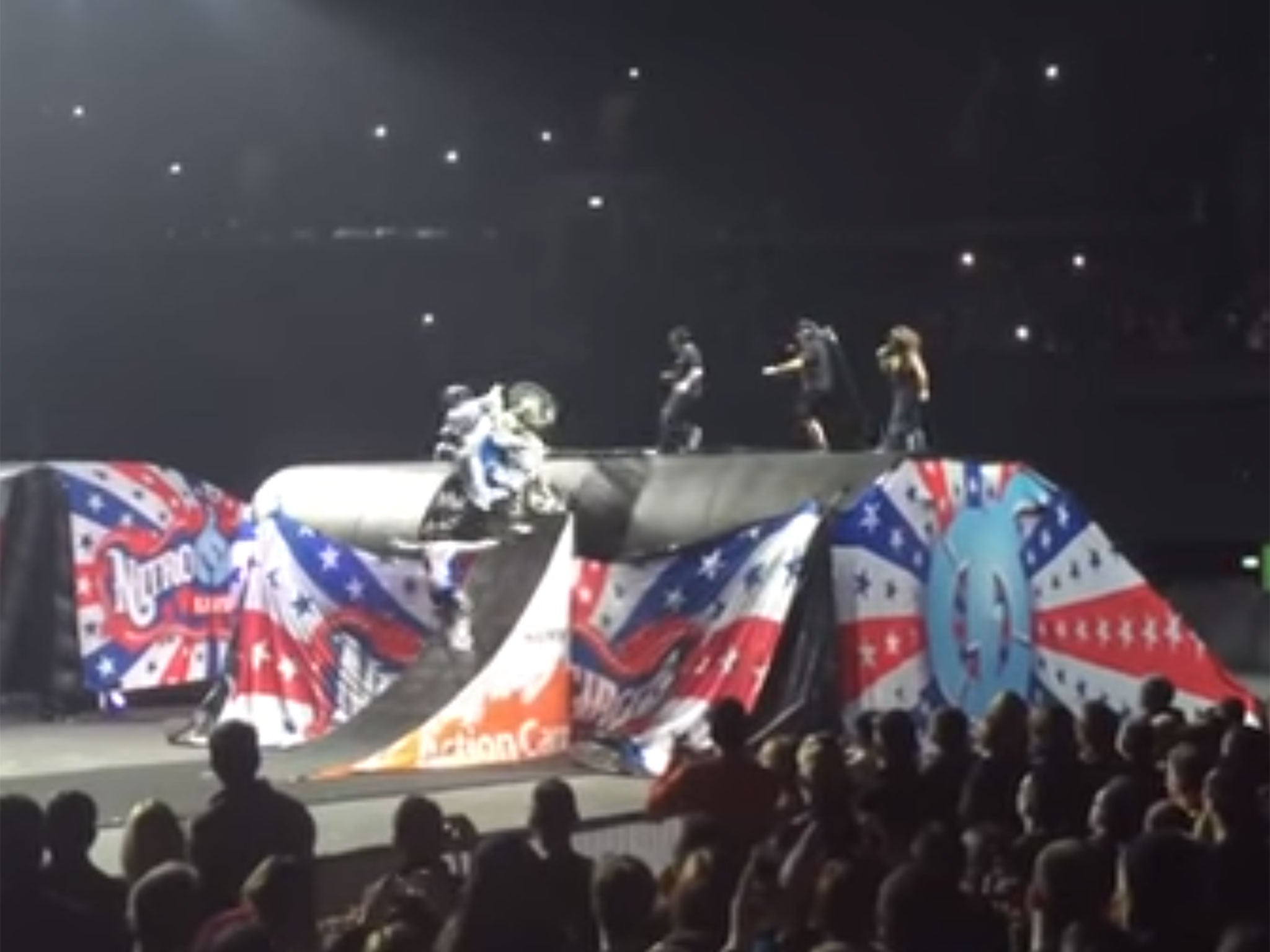 An audience member captures the moment a motorbike stunt goes wrong