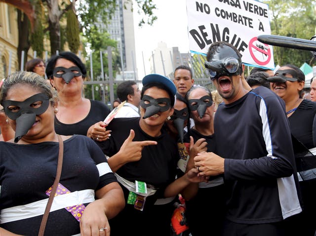 Revellers wear mosquito masks in a reference to the Aedes aegypti mosquito, which can spread dengue as well as the Zika virus, during a street carnival in Sao Paulo, Brazil, February 4, 2016