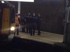Police storm London-bound train in manhunt for suspected killer 