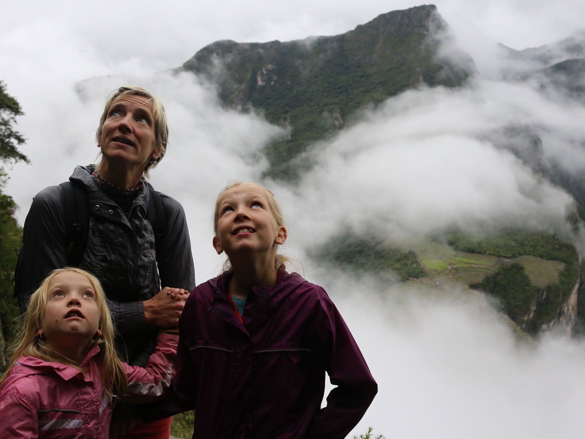 Cathy and her two older children halfway up Huayna Picchu, Peru