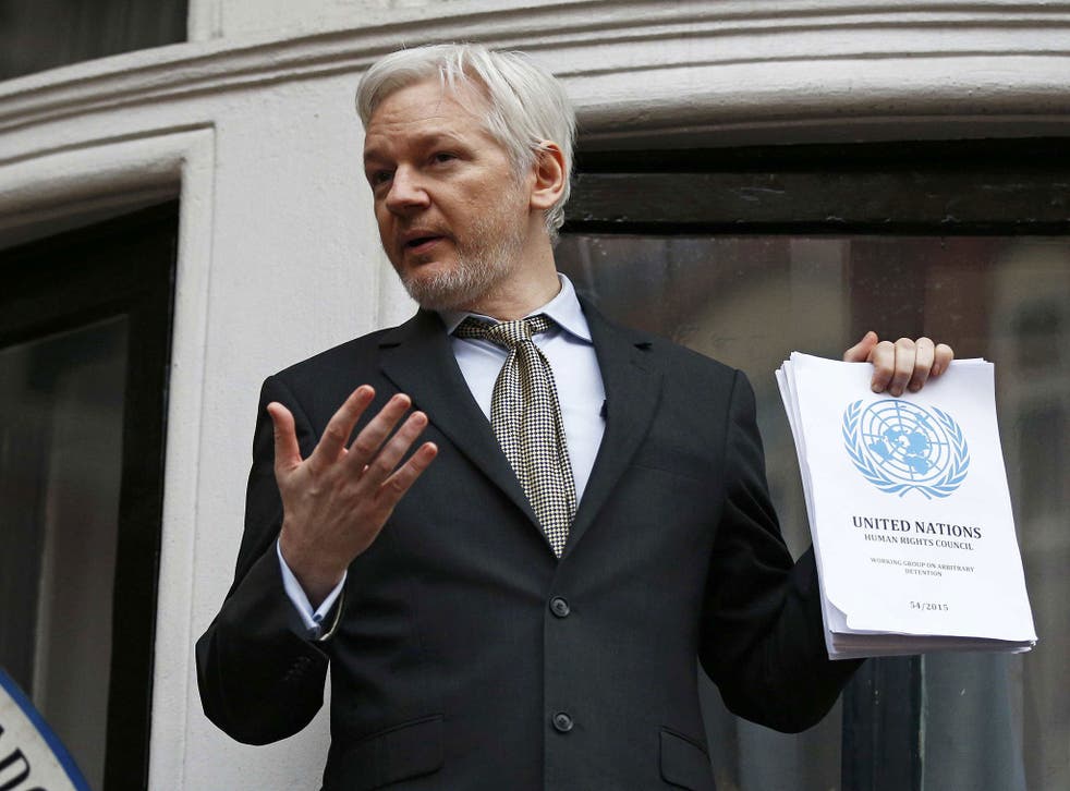 Julian Assange addresses the media on the balcony of the Ecuadorian embassy in London