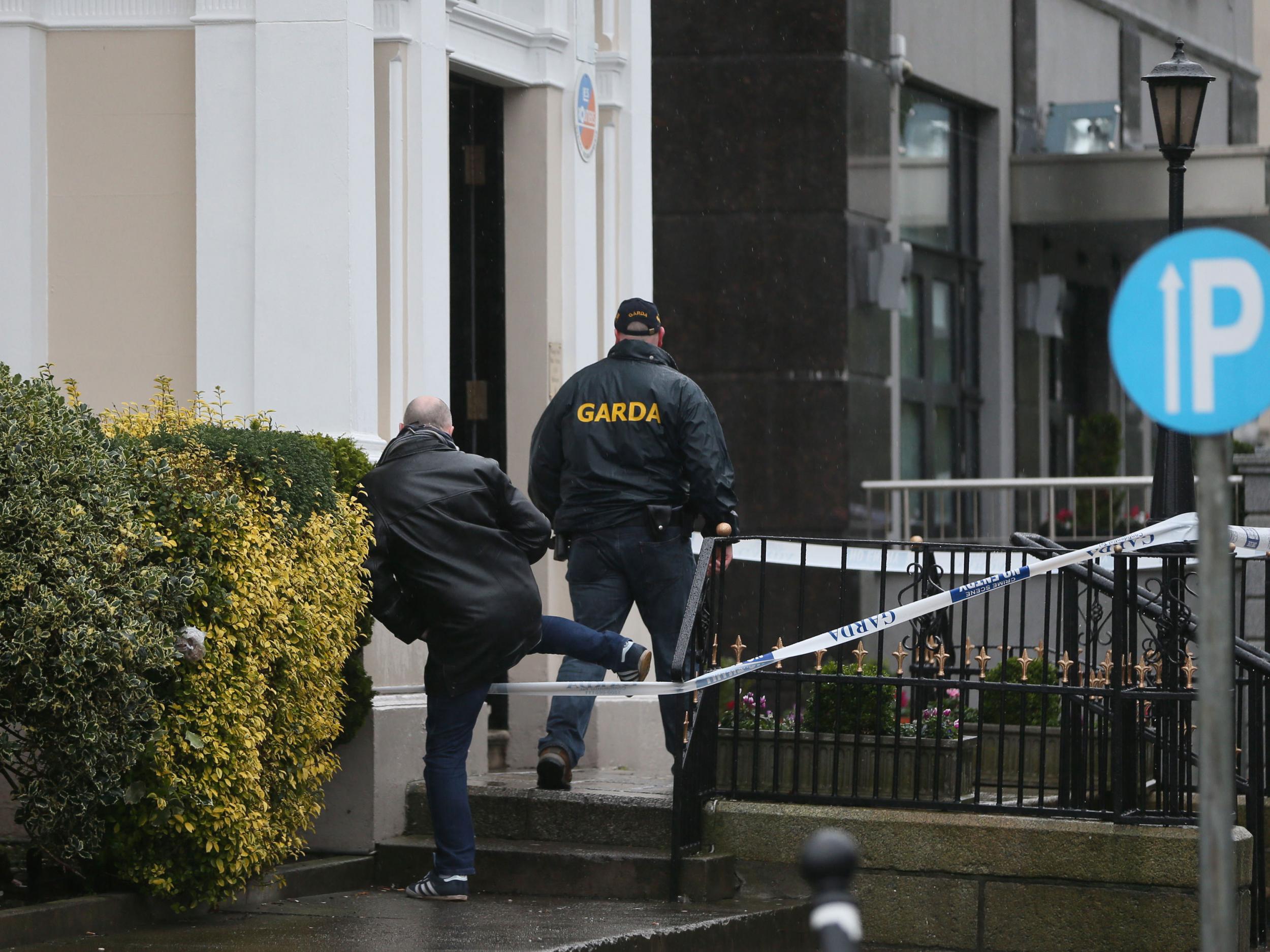 Gardai outside the Regency Hotel in Dublin after one man died and two others were injured following a shooting incident at the hotel PA