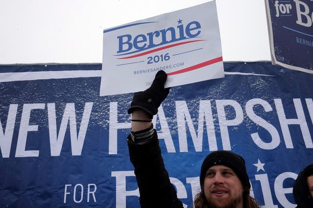 Supporters of US Democratic presidential candidate Bernie Sanders cheer on a street in Manchester, New Hampshire