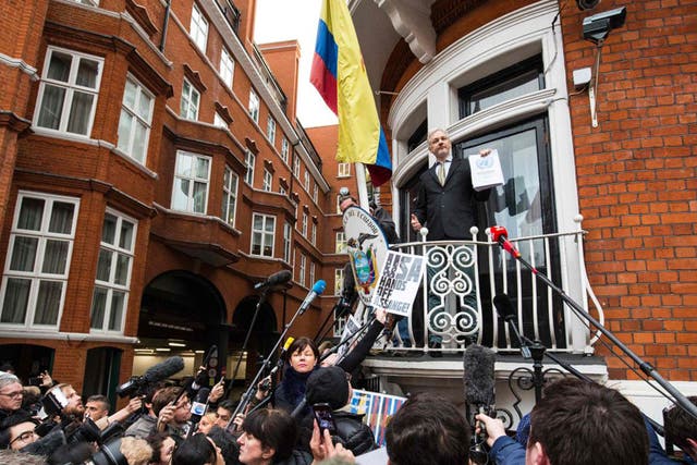 WikiLeaks founder Julian Assange (C) addresses media and supporters from the balcony of Ecuador's embassy in central London,