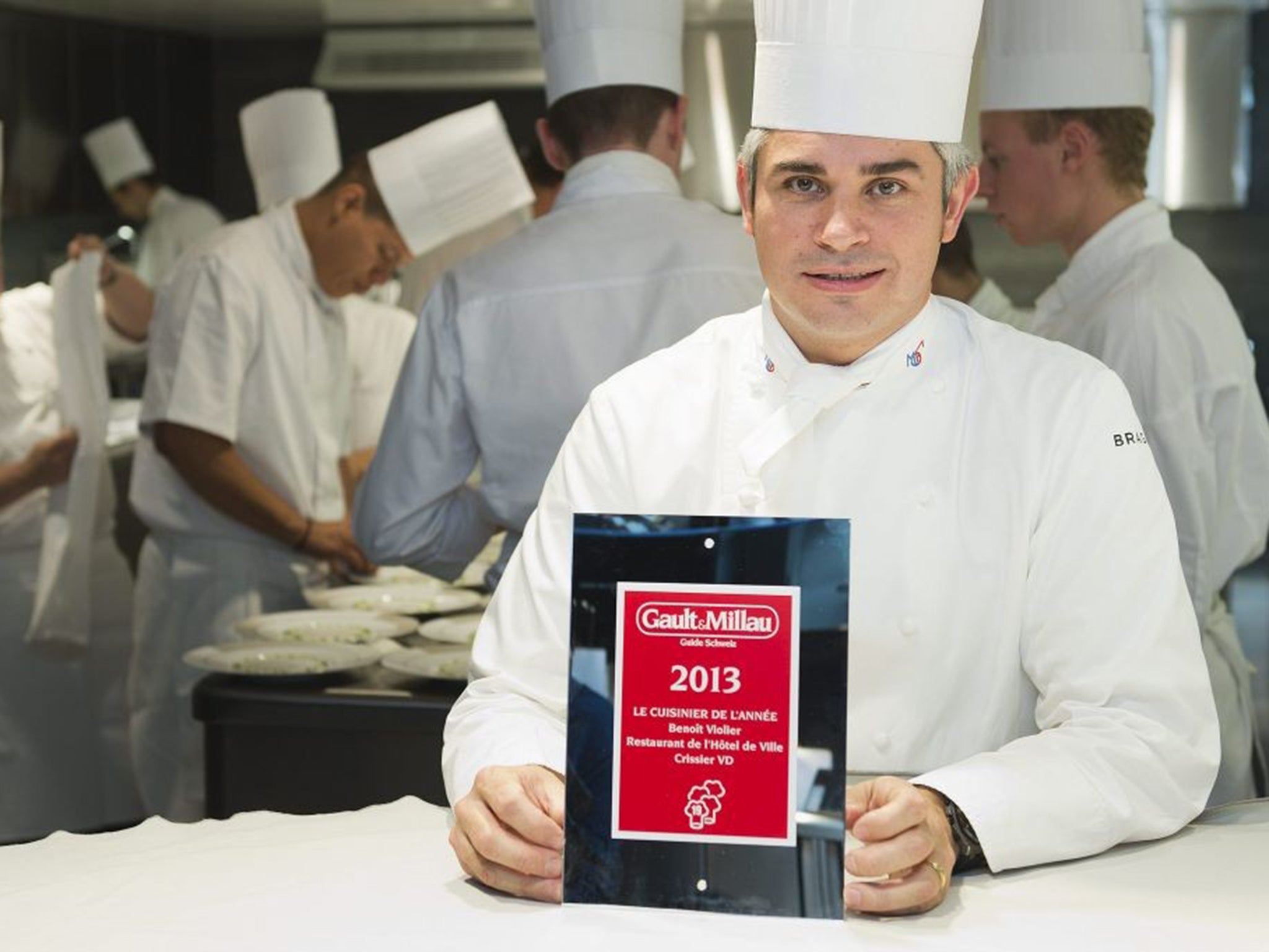 Violier in the kitchen of the Restaurant de l’Hôtel de Ville with his 2013 Chef of the Year award