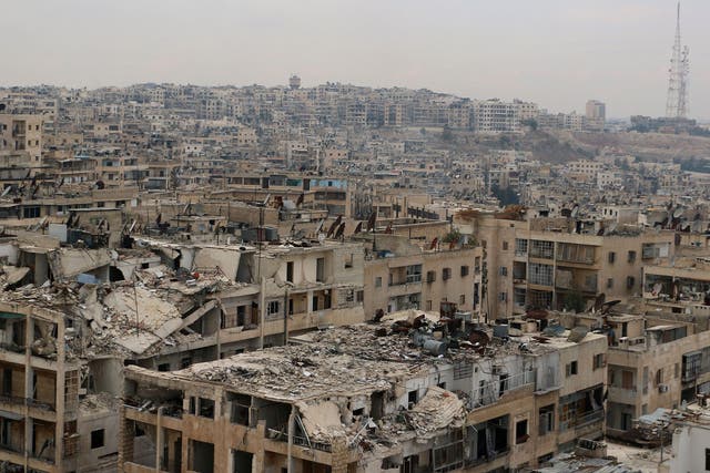 Damaged buildings in the rebel-held Ansari district of the northern Syrian city of Aleppo, 24 November, 2014