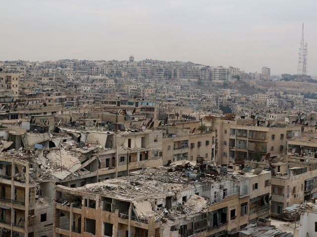 Damaged buildings in the rebel-held Ansari district of the northern Syrian city of Aleppo, 24 November, 2014
