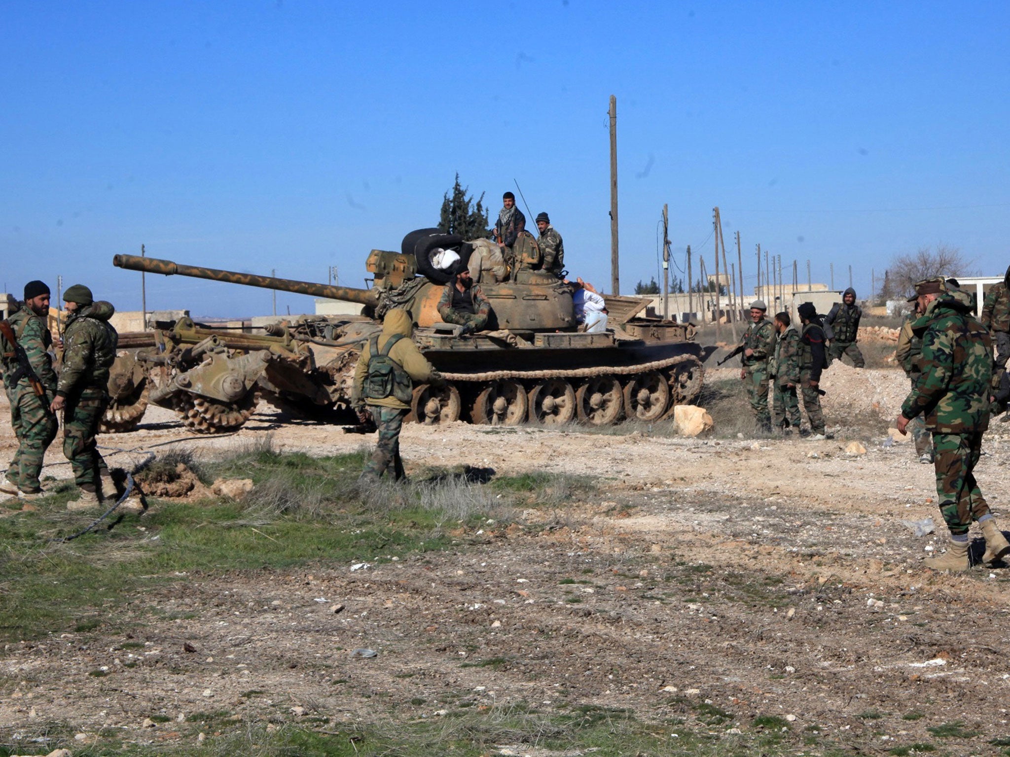 Syrian pro-government troops hold positions in the Syrian town of Ain al-Hanash near l-Bab in Aleppo's eastern countryside on 26 January, 2016