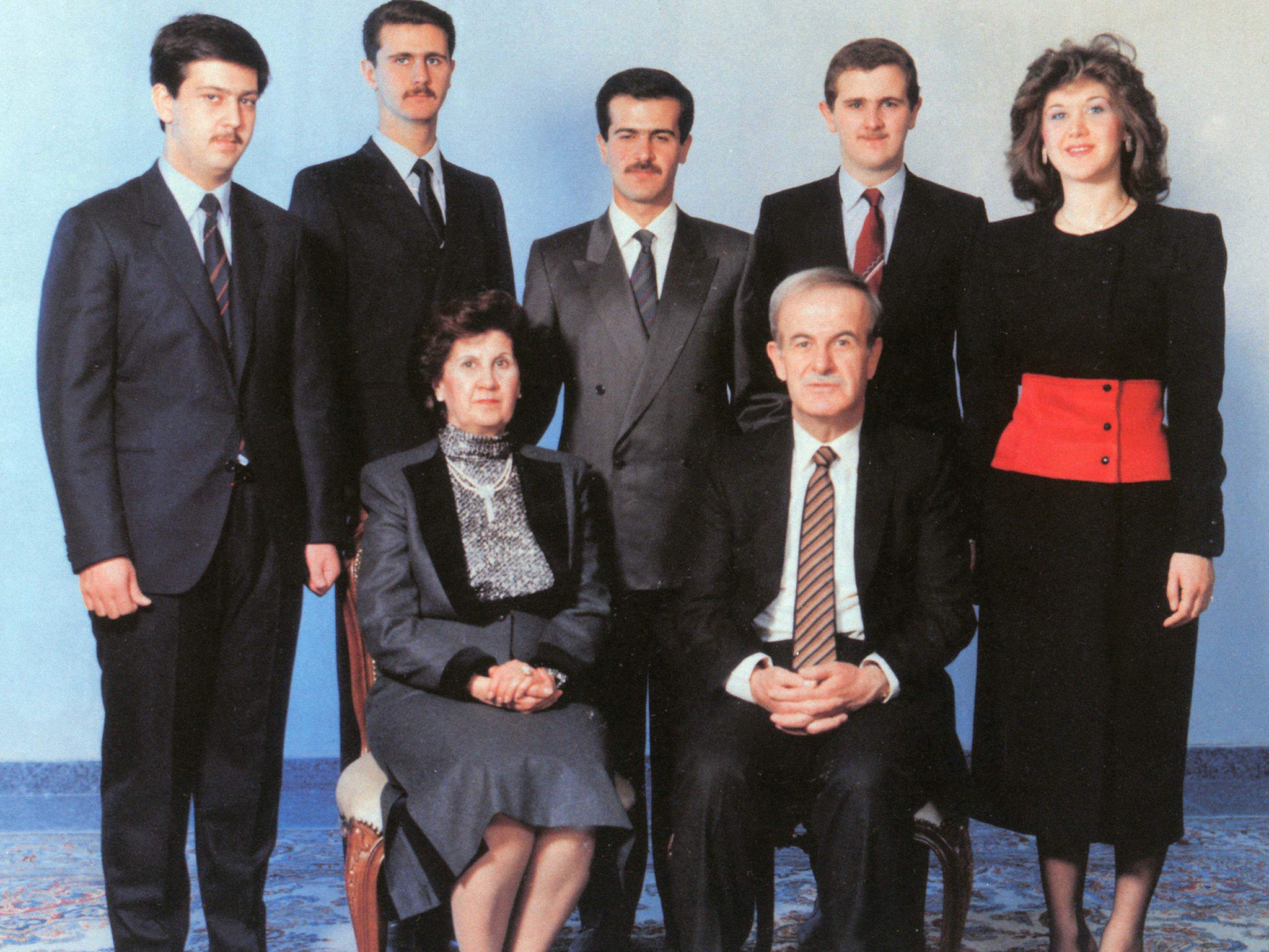 Former Syrian President Hafez al-Assad, front right, beside his wife Anissa, and family behind, including Bashar al-Assad, second from left, in 1986