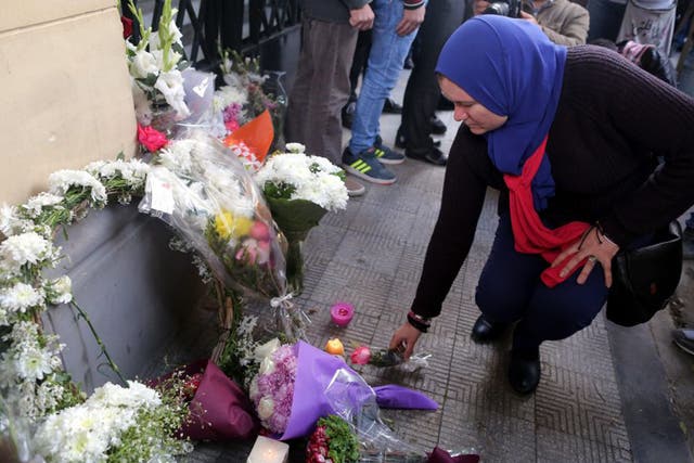 Activists lay flowers for Giulio Regeni at Cairo’s Italian embassy