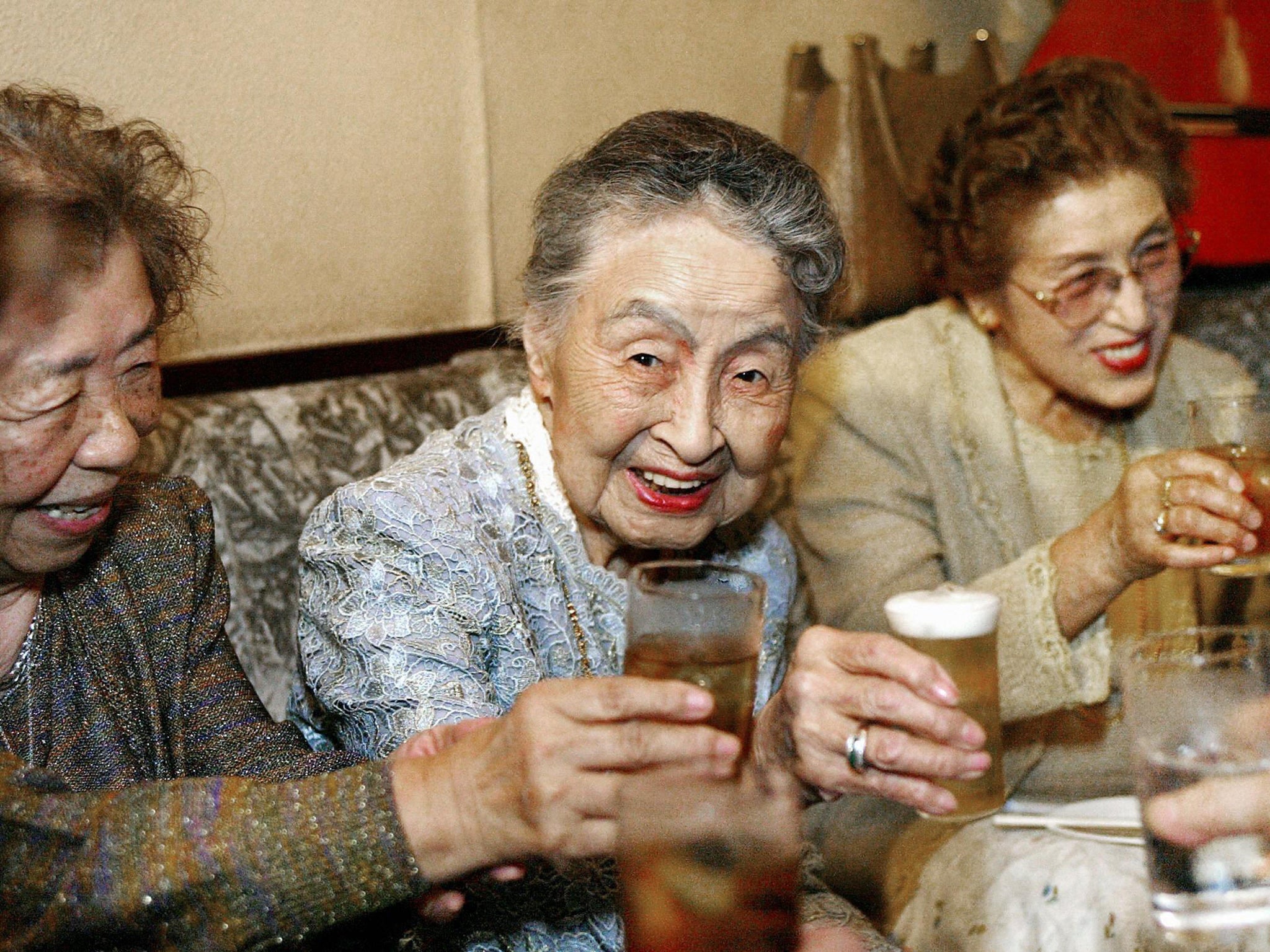 Hideko Arima celebrating her 101st birthday with a drink in Tokyo