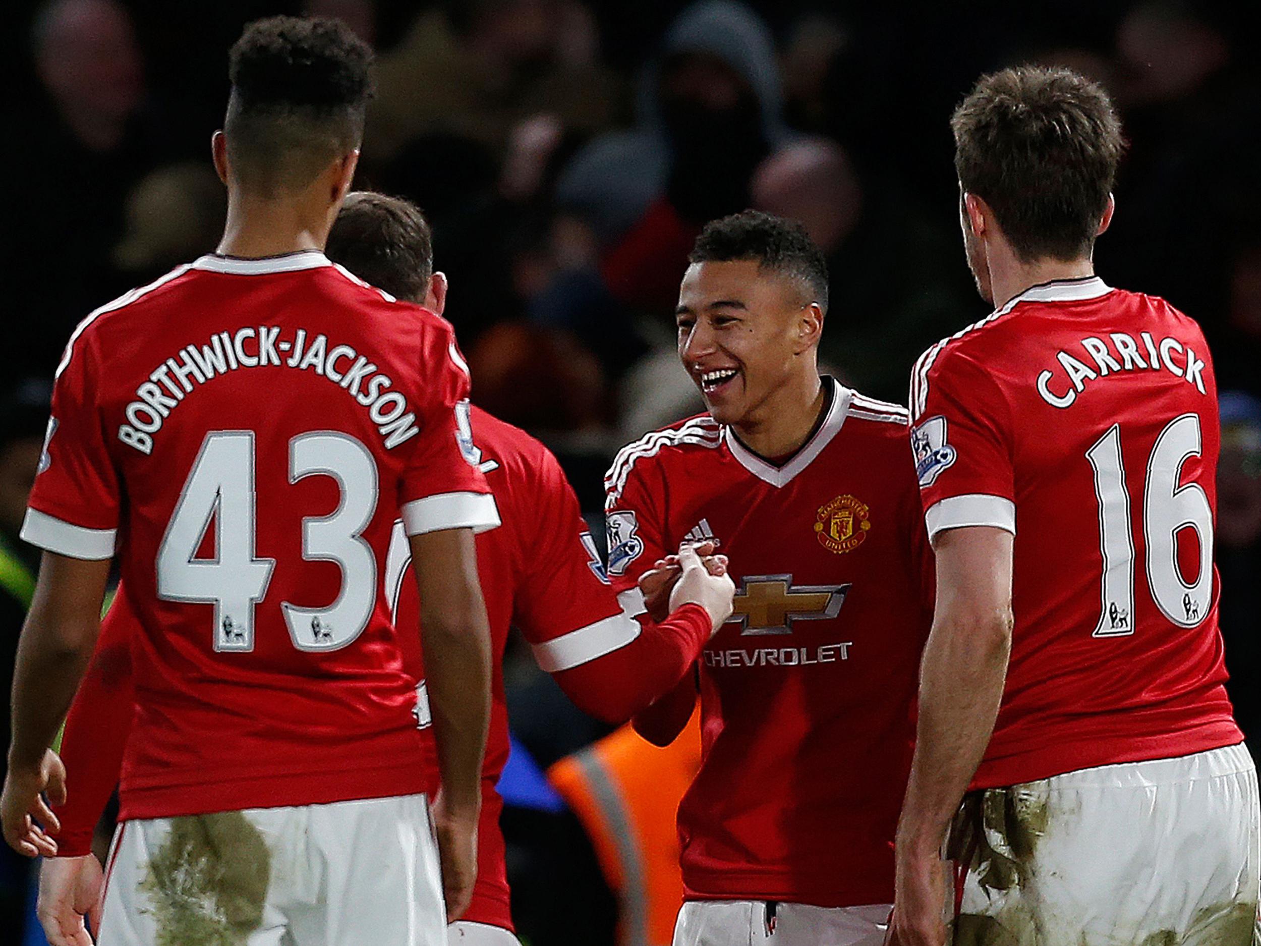 Jesse Lingard is congratulated on his fine goal against Chelsea