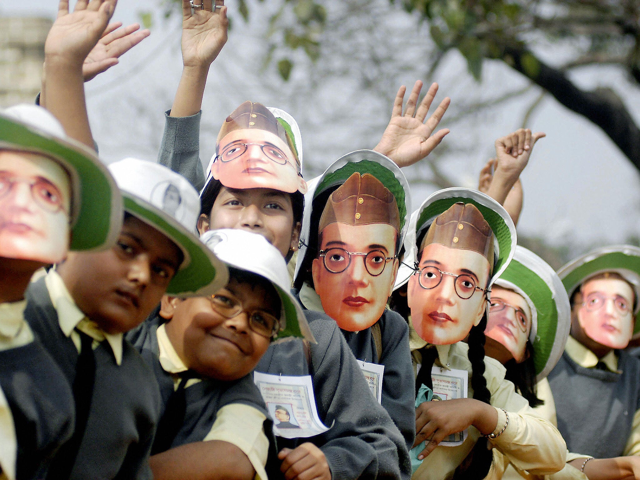 Children in Calcutta, West Bengal, wear paper masks to celebrate Bose’s birthday