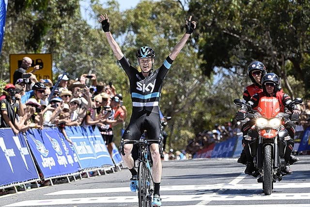 Chris Froome celebrates winning the final race stage