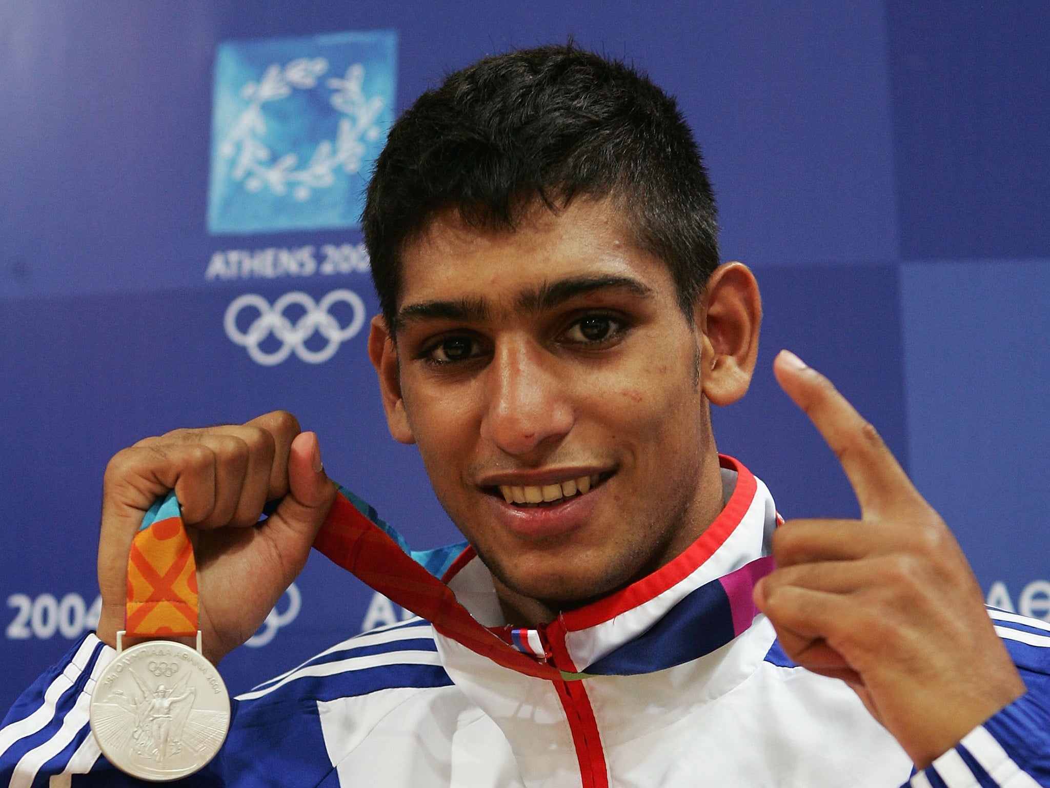 Khan celebrating his silver-medal win for Team GB at Athens 2004