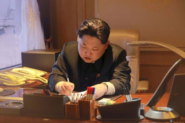 The most recent image of Kim Jong-un released by the North Korean government - purportly showing him signing off on a rocket launch