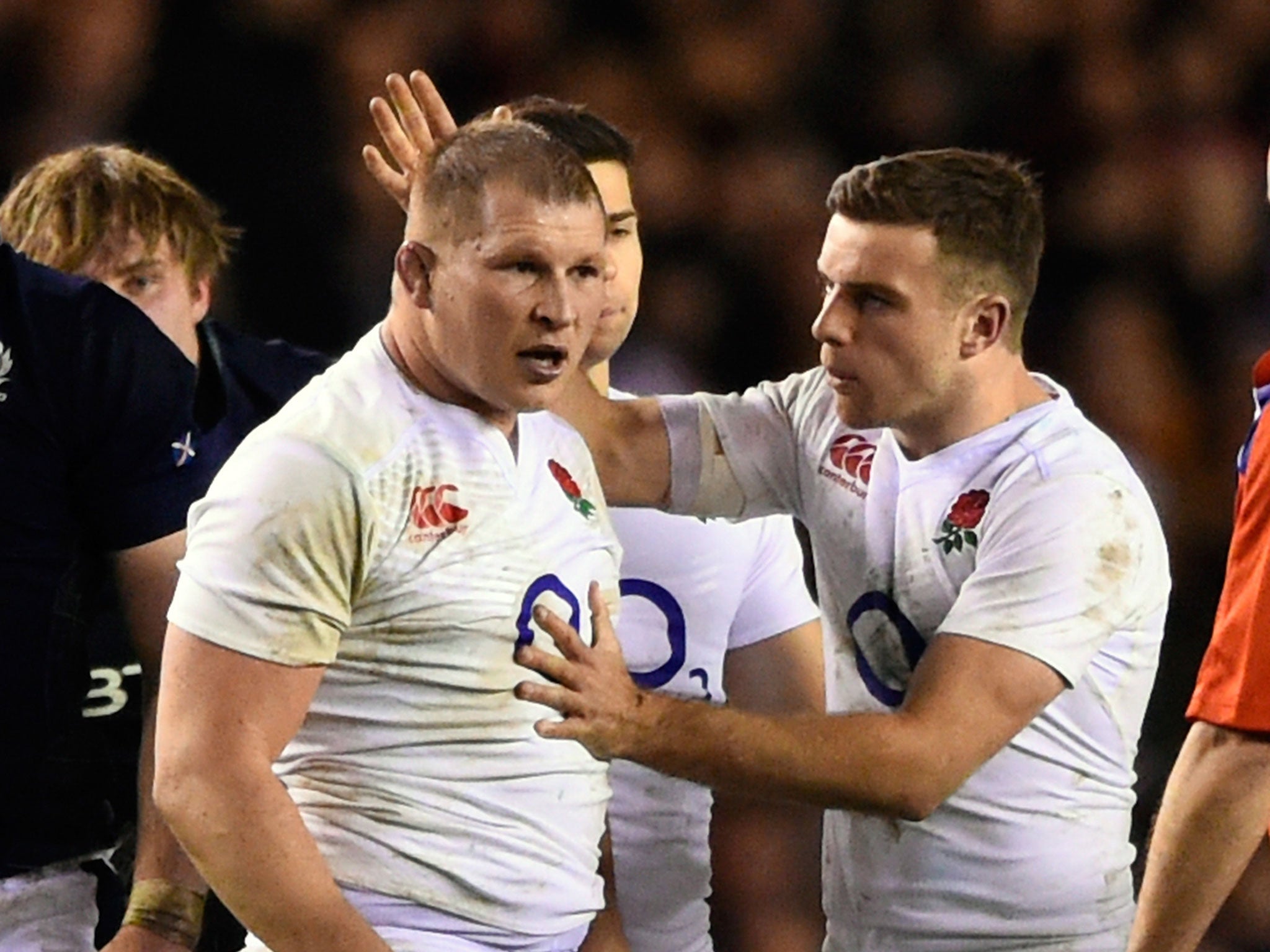 The England captain, Dylan Hartley is congratulated by teammate George Ford after the forwards won a penalty at the scrum against Scotland