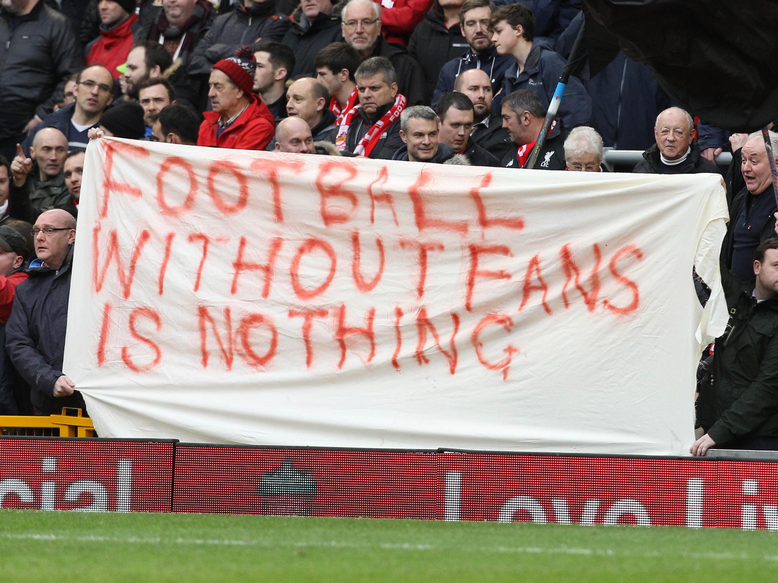 Liverpool fans unfurl a banner at Anfield