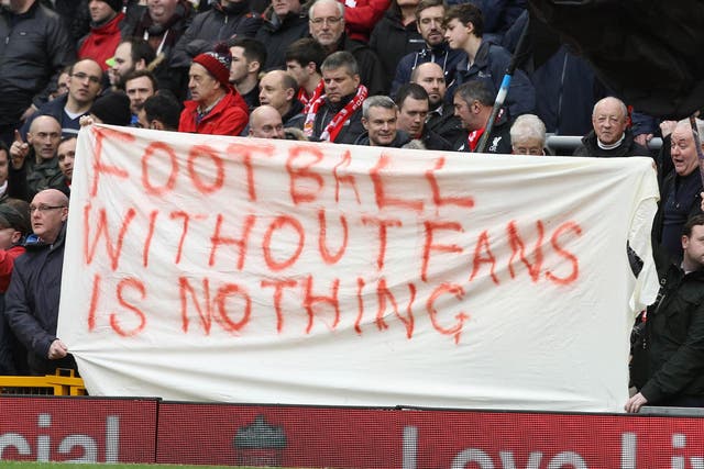 Liverpool fans unfurl a banner at Anfield
