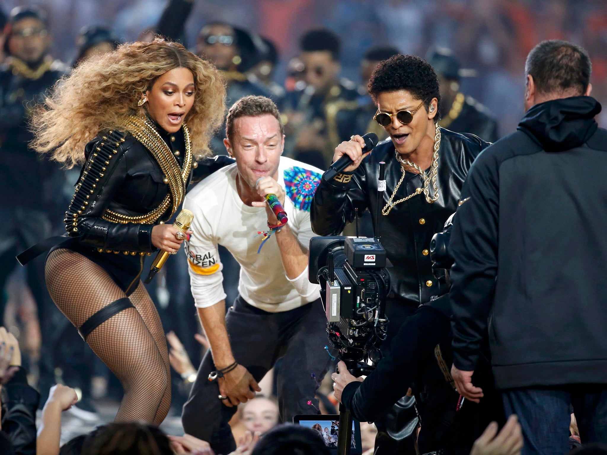 Beyonce (L), Chris Martin (C) and Bruno Mars perform during the half-time show at the NFL's Super Bowl 50 between the Carolina Panthers and the Denver Broncos in Santa Clara, California