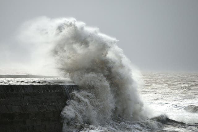 Waves crash against the harbour wall in Lyme Regis, Dorset as winds of nearly 100mph battered Britain after Storm Imogen slammed into the south coast