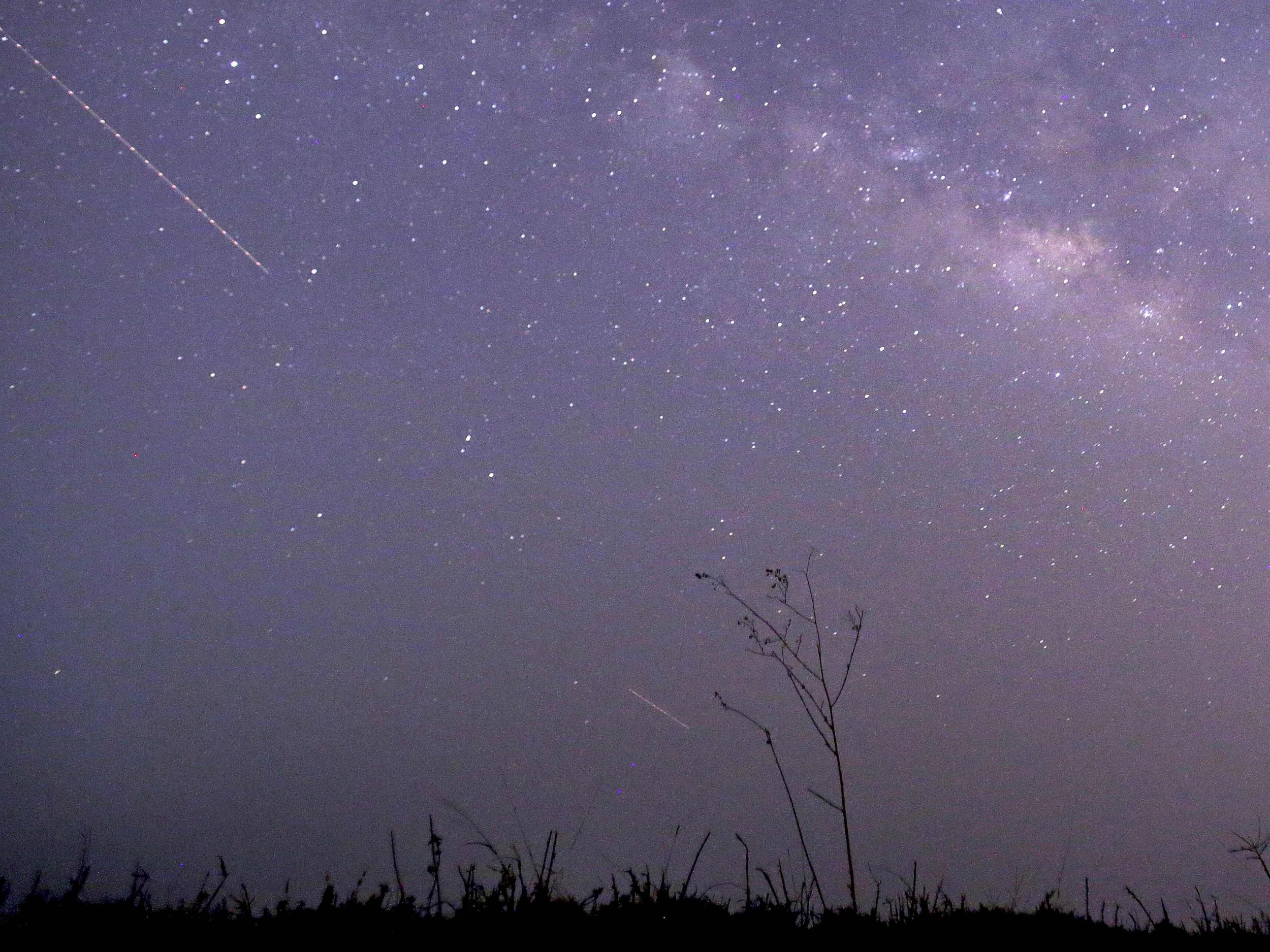 A long-exposure photograph shows the Lyrids meteor shower over Yangon in Myanmar