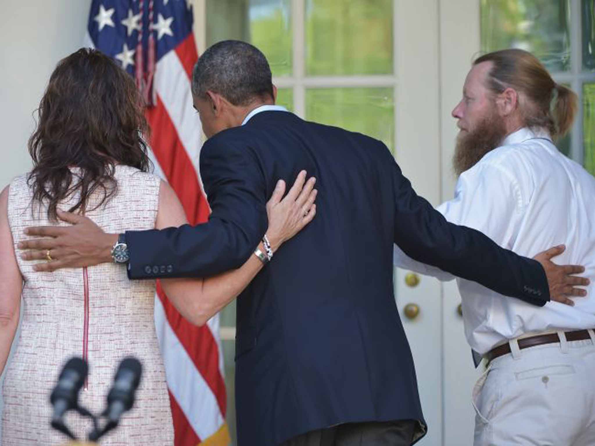 President Barack Obama with his parents Jani and Bob Bergdahl