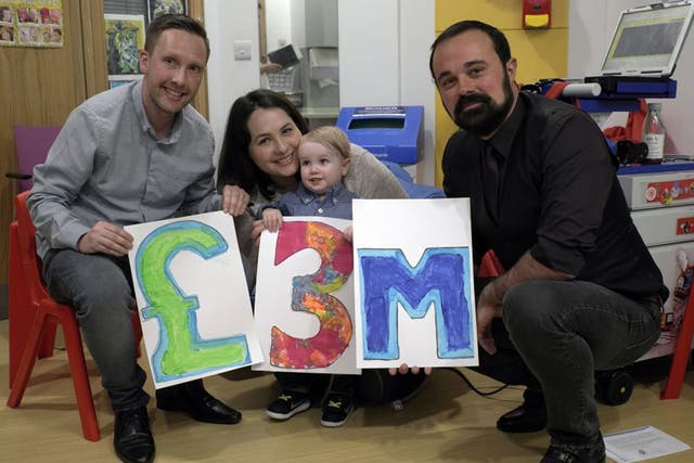 Two-year-old Elliot Livingstone, who is being treated at GOSH while he waits for a heart transplant, and his parents, Adrian and Candace, celebrate £3 million being raised with Evgeny Lebedev, the owner of The Independent and Evening Standard