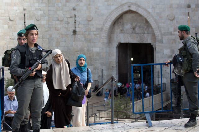 Palestinian women cross into Israel via the Damascus Gate in east Jerusalem