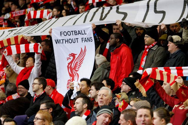 Liverpool fans hold up a banner protesting at prices during the 2-2 draw with Sunderland