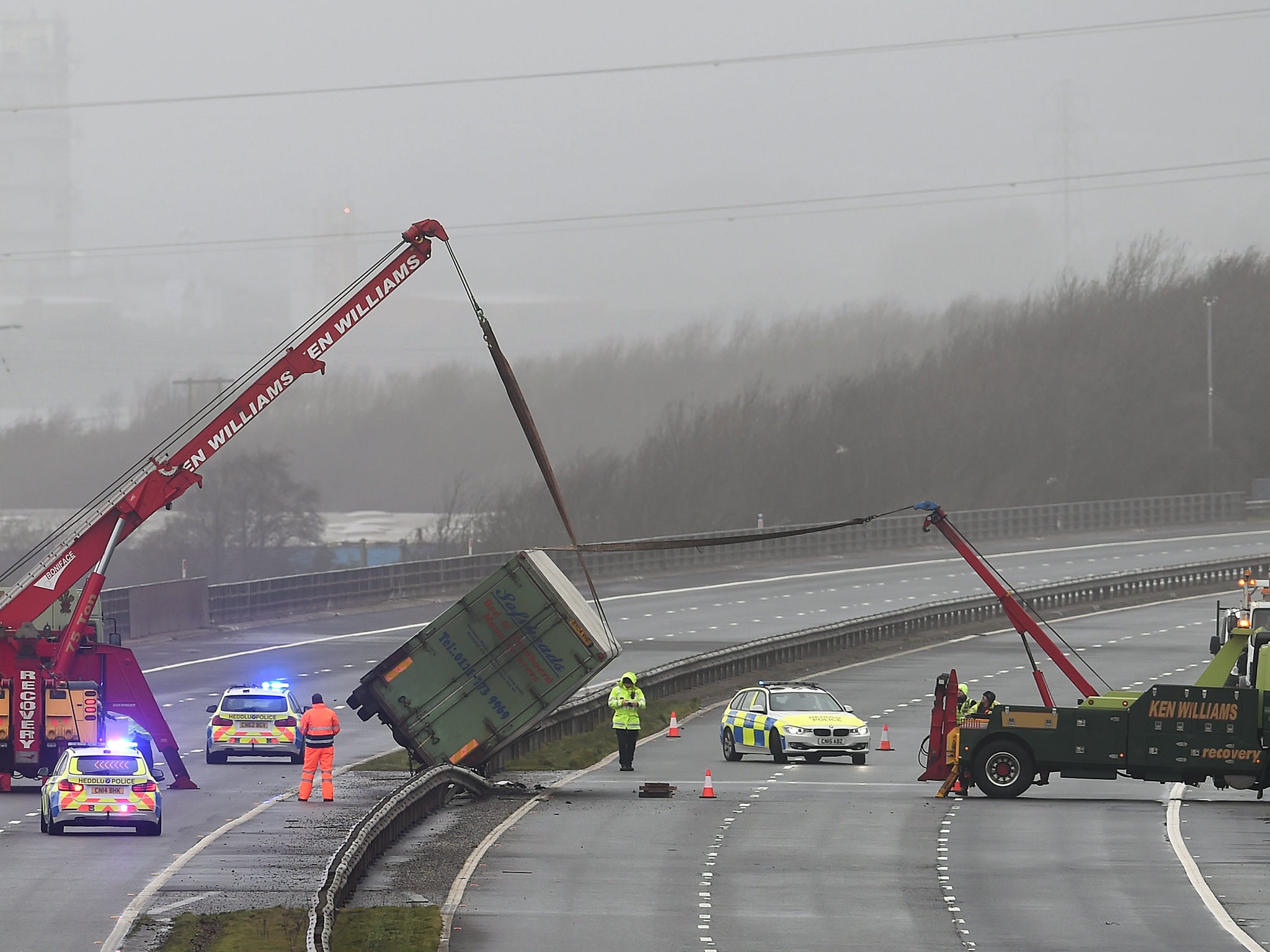 &#13;
Recovery vehicles work to right an oerturned lorry on the M4 between Bridgend and Port Talbot &#13;