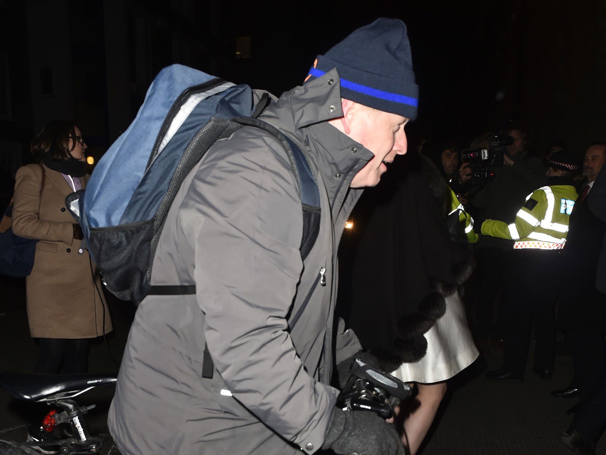 Boris Johnson leaves the event on his bike, as is his custom