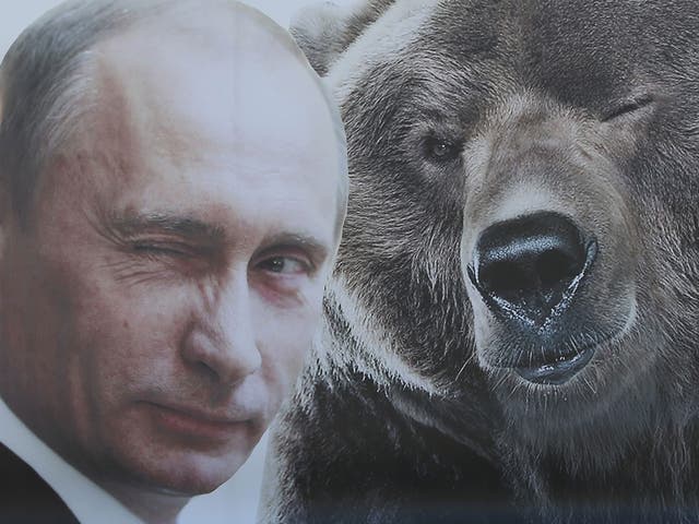 A portrait of a winking Russian President Vladimir Putin and a bear at Victory Park on 8 May, 2015