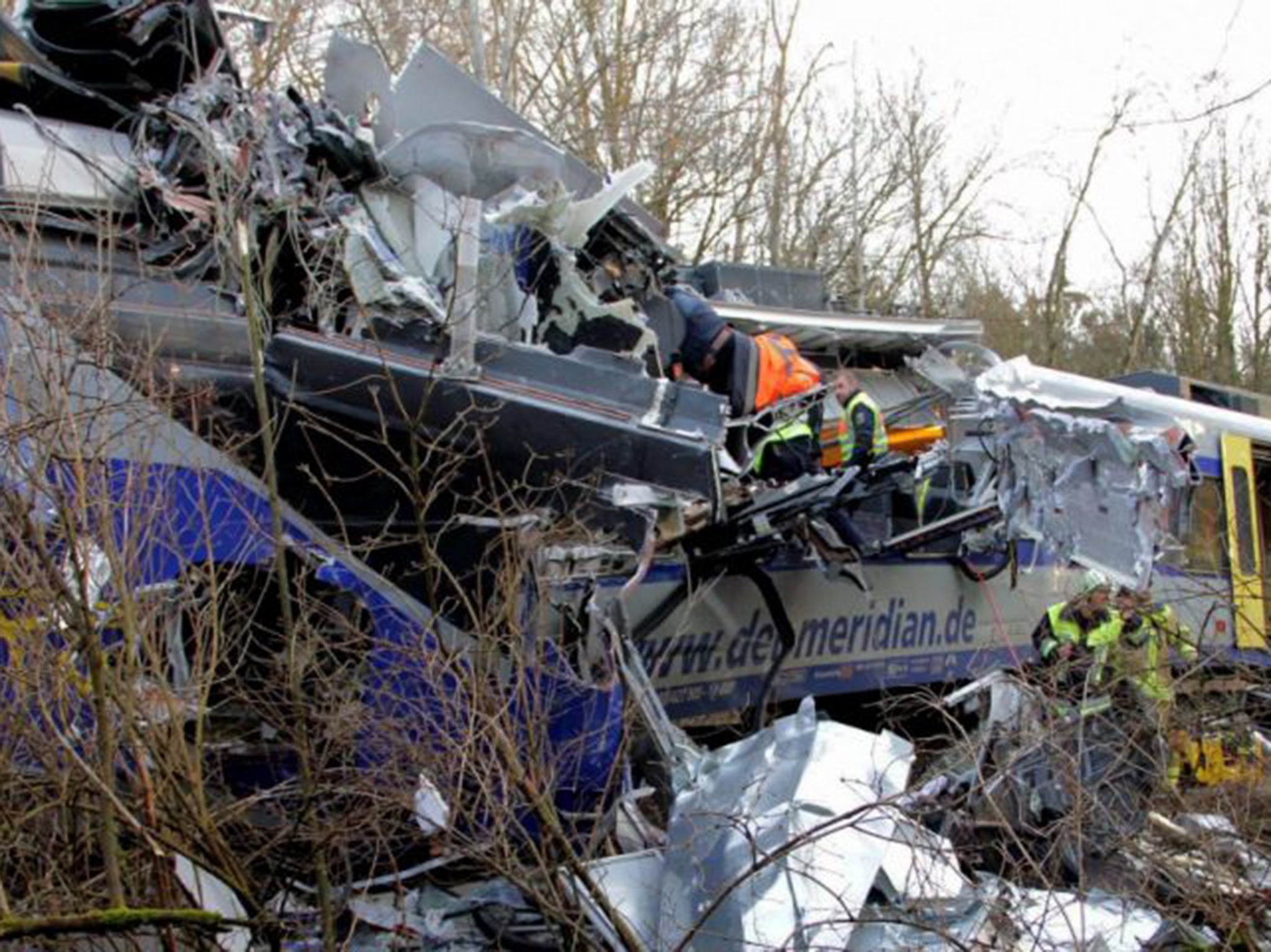 Rescue workers at the scene of the train crash near Bad Aibling yesterday