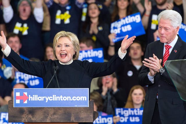 Hillary Clinton delivers her concession speech in the New Hampshire primary as husband Bill watches on